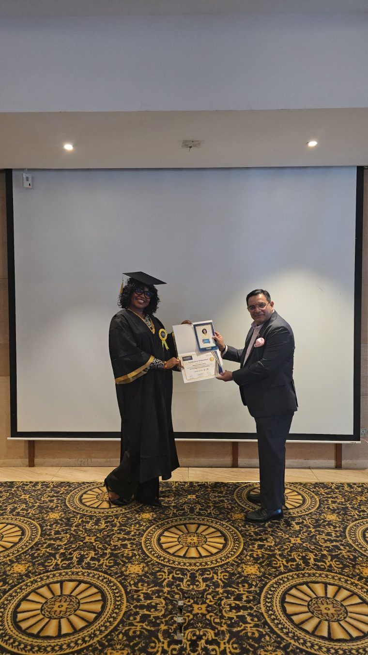 Overseas corporate training graduate receiving her completion certificate