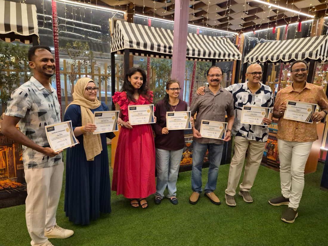 Corporate training cohort of financial consultants and auditors holding their certificates of achievement